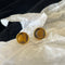 Round amber stud earrings 02698