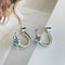 Saturn aqua blue diamond earrings  02456