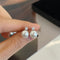 Here come the pearl stud earrings 02658